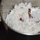Step four: Pulse the grated coconut 1 or 2 times.