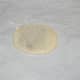 Step nine: Pull the dough, and fold the sides to cover the jaggery-coconut ball with the dough. Take it in your palm. Roll it around along with the stuffing to make a round ball.