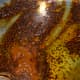 Step two: Add turmeric powder and red chili powder. Keep the fire very low. Mix once.