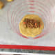 Scoop the filling into the dough circles.