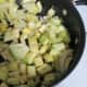 Add eggplant to onions. Stir to coat with oil.