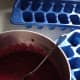 If the frozen baby food does not want to release from the ice cube tray, set the tray in a rimmed baking sheet with a little warm water for a few seconds, and then try again, they'll side right out!