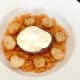 Crispy poached egg is laid on burger