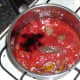 Seasonings are added to tomato sauce