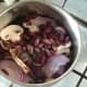 Bean salad ingredients are added to saucepan