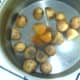 Potatoes are seasoned prior to being boiled.