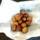 Roast potatoes are drained on kitchen paper