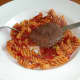 Enjoying buffalo and beef burgher with pasta