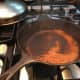 Frying spices; a lot of smoke comes from this
