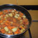 Step 5: Pour about 4 cups of water. Increase the heat. Let the mix boil for a few minutes.
