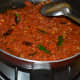 Step eight: Turn off the stove. Your yummy, tangy, and aromatic tomato curry is ready to serve! 