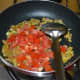 Add the chopped tomatoes and stir-cook them until they become mushy. 