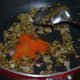 Step five: Add red chili powder, garam masala powder, cumin-coriander powder, and turmeric powder. Saute for 30 seconds.