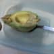 scoop green avocado from outside