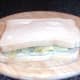Assembled mint sauce houmous and salt and vinegar crisps sandwich