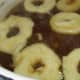 Put raised bagels in boiling sugar water.