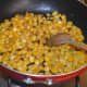 Step three: Throw in corn kernels and some salt. Stir-cook for 3-4 minutes. Now, the corn becomes soft, yet retains crunchiness.