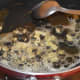 Step two: Heat 1 tsp butter in a deep-bottomed pan. Add chopped garlic. Saute till they are golden brown.