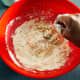 Use your hands to combine the mixture. Knead until it forms a dough. 