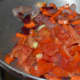 Step two: Add chopped tomatoes. Continue sauteing till they become a little mushy.