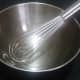 I prefer to use a whisk and a large metal bowl to incorporate all of the spices into the popcorn.