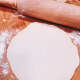 Use a rolling pin to roll the dough until flat.