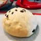 Transfer the dough onto a floured surface/baking mat. Shape the dough into a ball. 