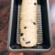Transfer the dough into a greased loaf pan. Let it rest for 45 to 1 hour before baking.