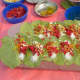 betel leaves with the paan ingredients.each betel leaf will be folded to make a paan