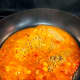 In another pan, cook the sauce.