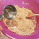 Then I dump it into a large bowl and add all of my other ingredients. If your dough isn't coming together, you may need a little more water.