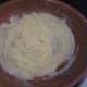 Step 5: Slowly add milk to butter and flour base