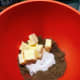 In a mixing bowl, combine the sugar, butter, dark brown sugar, vanilla, and egg. 