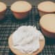 Use a frosting spatula or palette knife to spread the frosting on each cupcake.