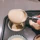 Use an ice cream scoop to fill each cupcake cup.