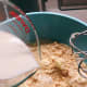 Combine the milk and water into the flour mixture.