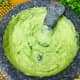 Add in the avocado pulp and again mash it until it is creamy with very few lumps.