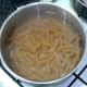 Simmering wholewheat fusilli pasta