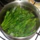Tenderstem broccoli is blanched in salted water