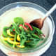 Salad is mixed through dressing