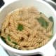 Drained pasta and spinach is left to steam
