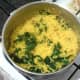 Drained spinach and turmeric rice