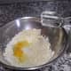 Add the eggs to the sugar mixture and blend well.