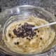 Add the mashed bananas and chocolate chips to the batter and mix gently.