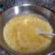 Fold in the 2 cans of crushed pineapple and combine the ingredients well.