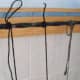You may have to modify your tying style according to the lengths of your strings. It is best if you can loop it around three times and pull the tail partly through the last loop for a "quick release" type knot..
