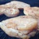 raw chicken on the grill
