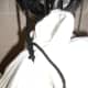Knotting details on the bag. The corners of the bag are gathered together, and the shoelace is knotted around the "neck" at least three times.