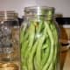 A nicely packed jar of whole French filet green beans.