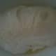 The dough goes into an oiled bowl to rise.